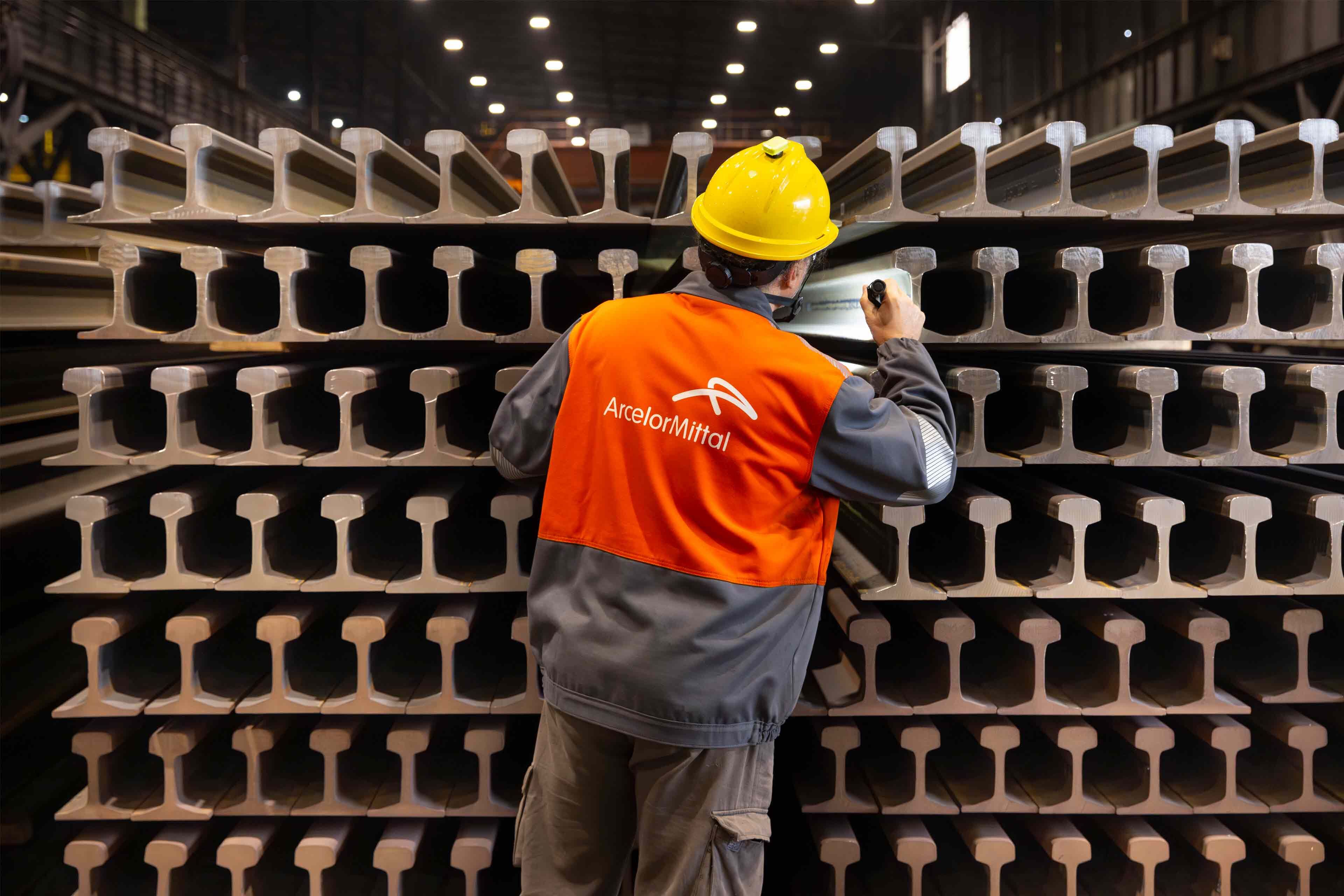 ArcelorMittal Gijon colleague inspecting completed railway rails.jpg