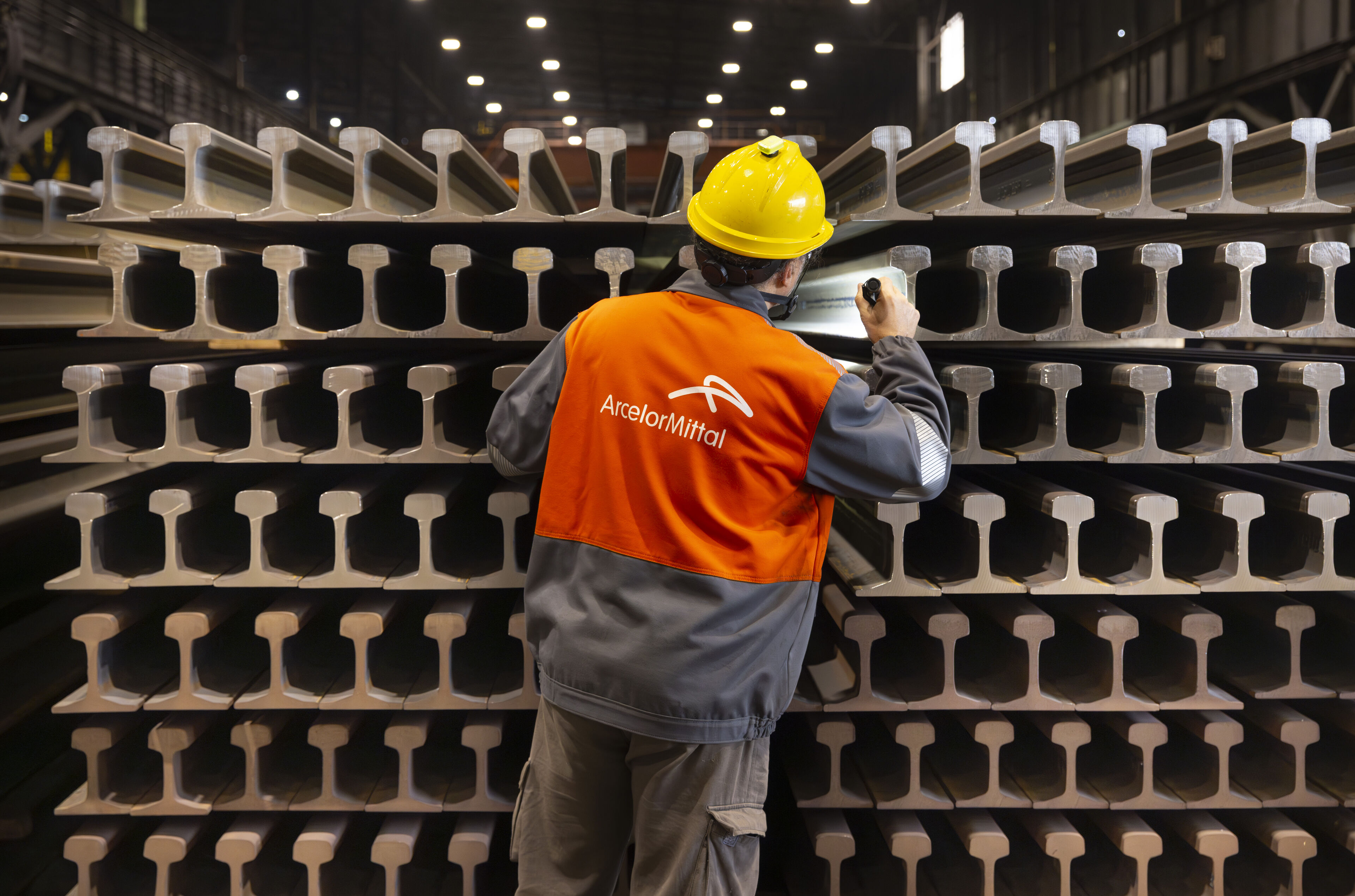 ArcelorMittal Gijon colleague inspecting completed railway rails (1).jpg