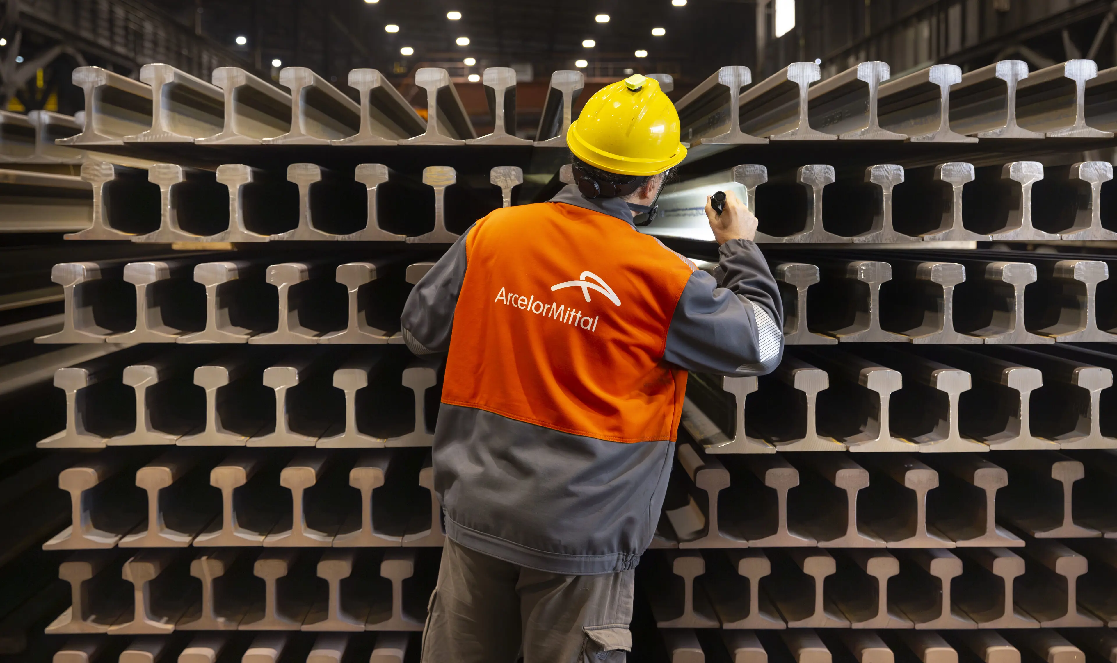 ArcelorMittal Gijon colleague inspecting completed railway rails (1).jpg