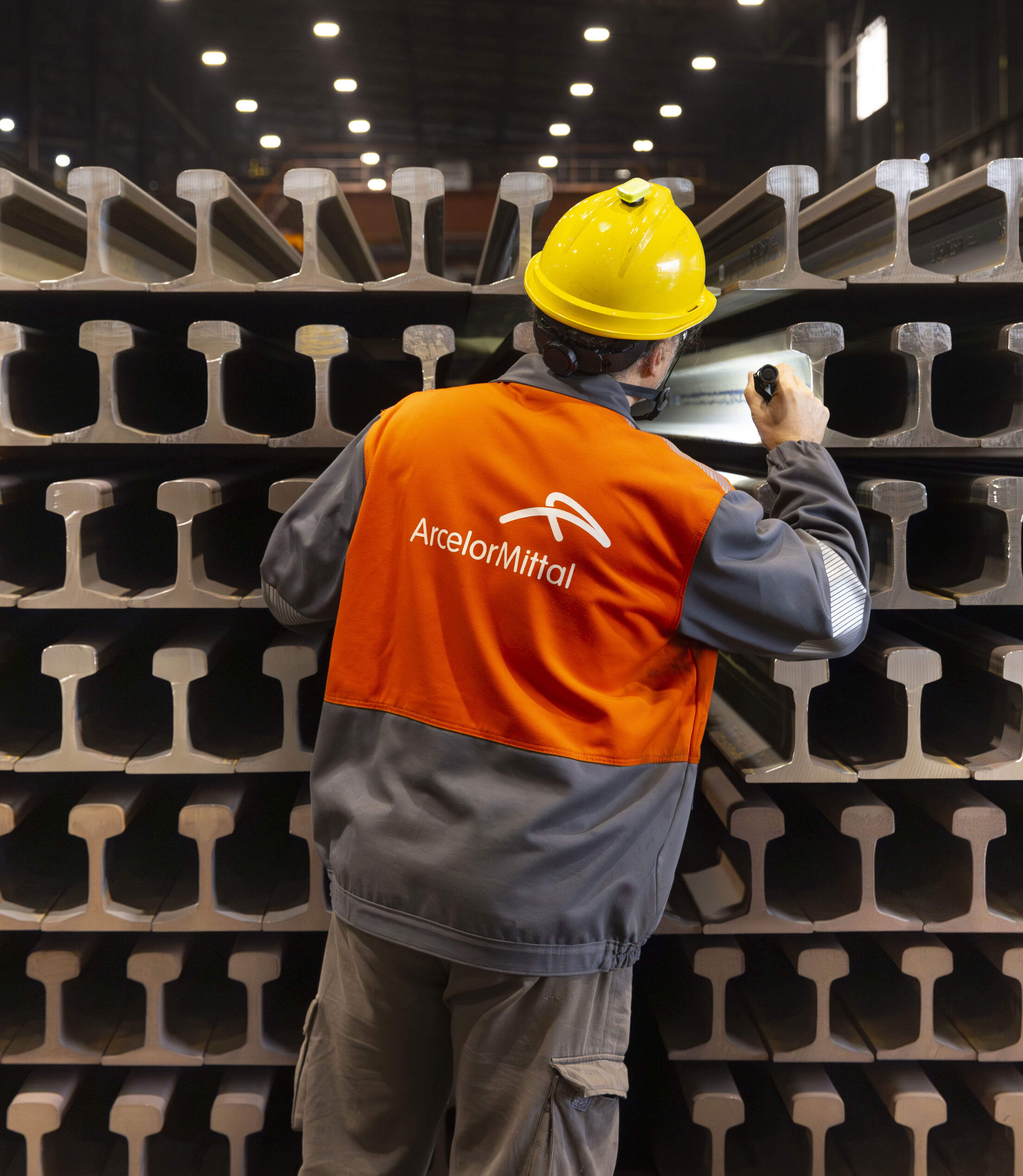 ArcelorMittal Gijon colleague inspecting completed railway rails (1).jpg