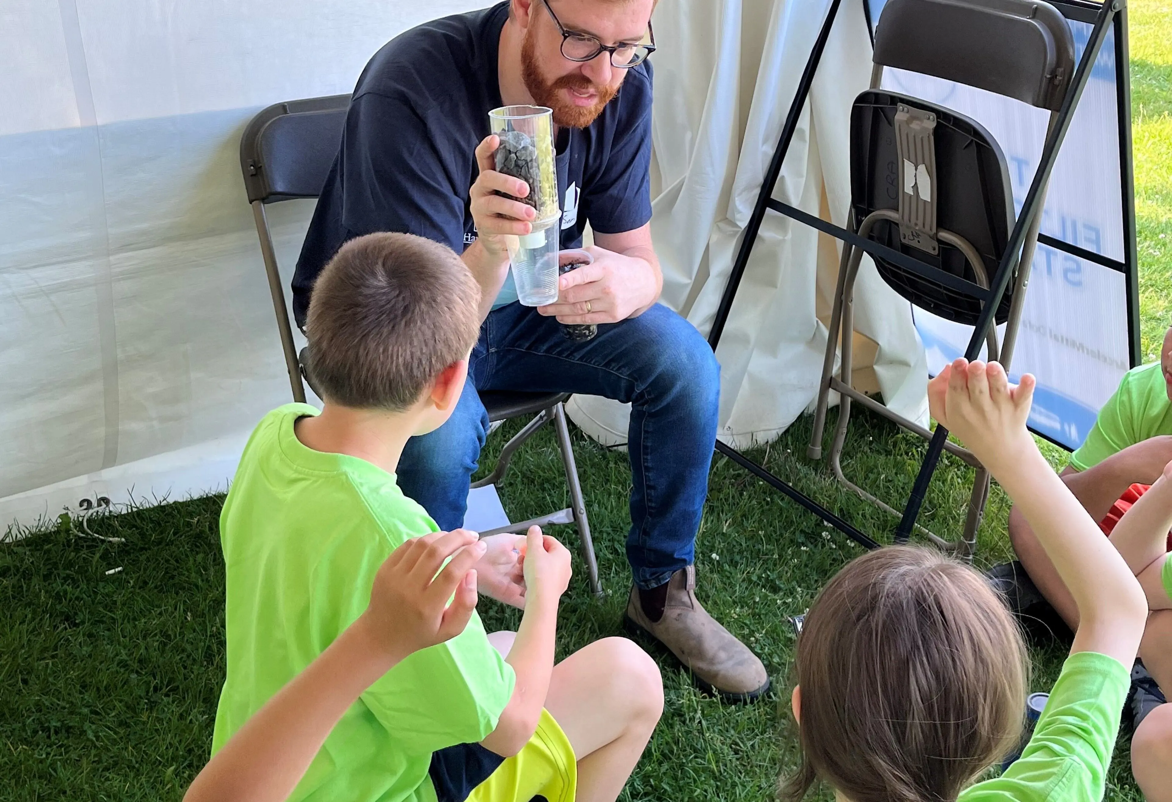 Employee meets with students for children's water festival