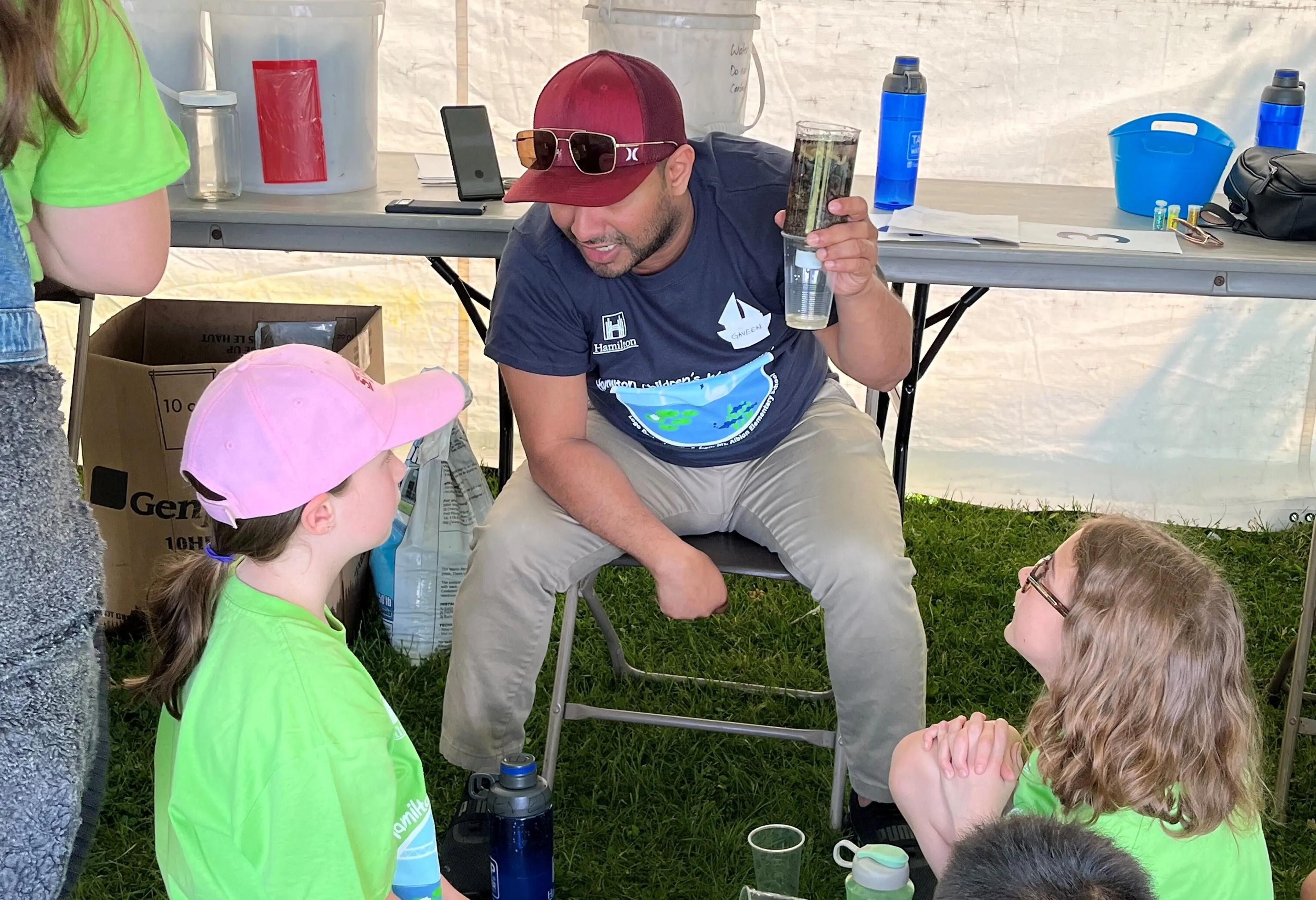 Students with employee at children's water festival