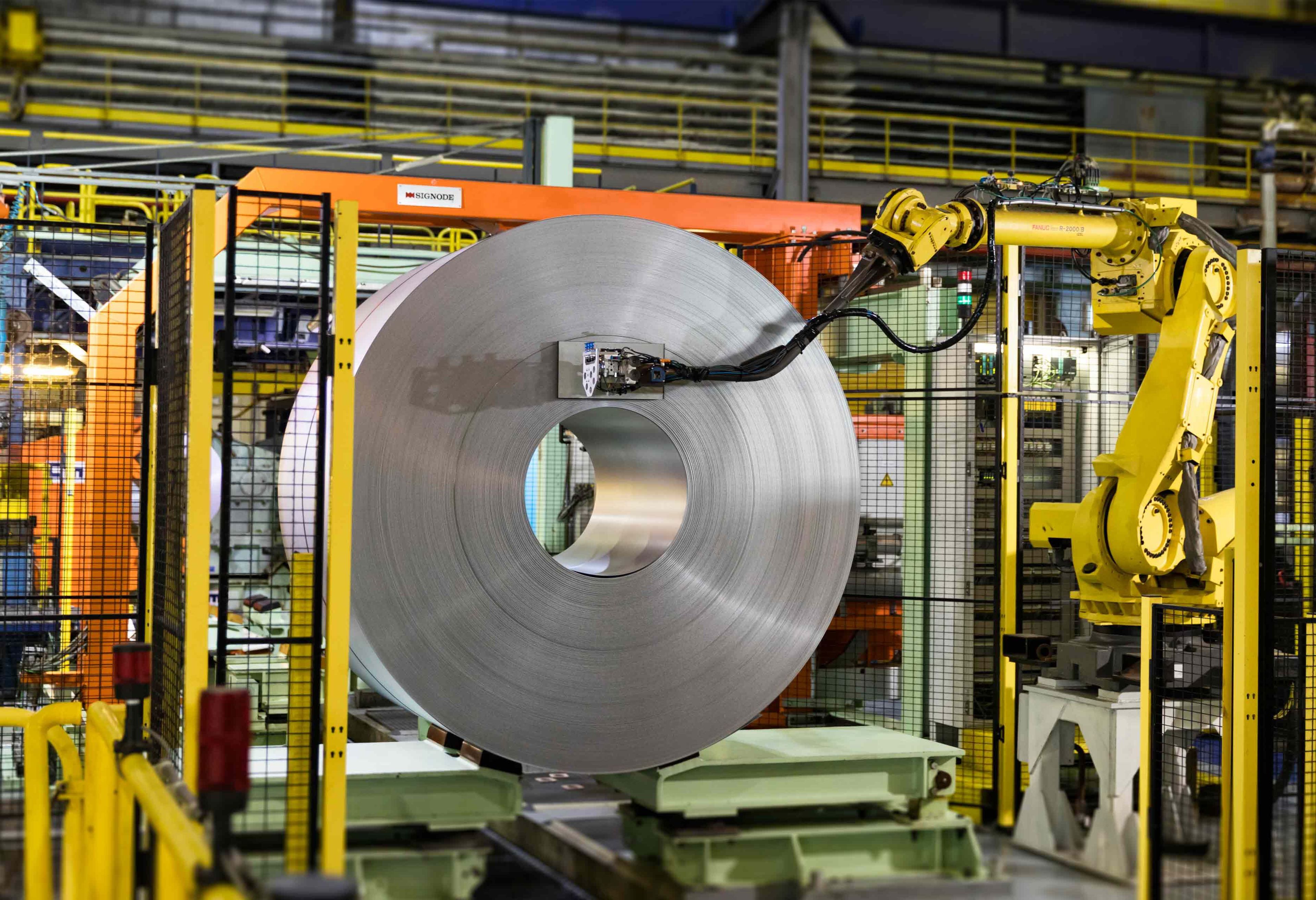 Robot preparing finished coil for packaging, Liège, Belgium.jpg