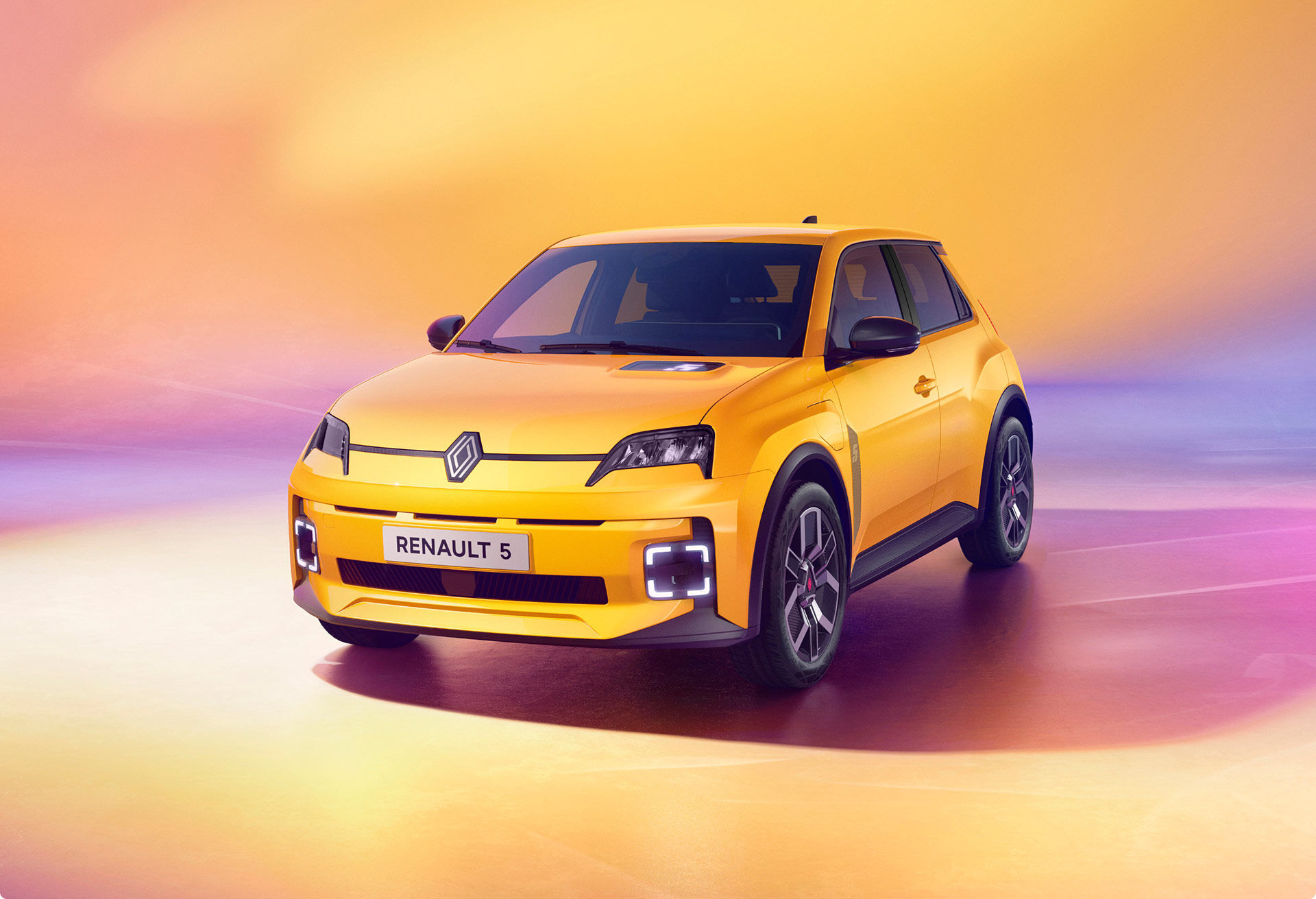 A yellow Renault electric vehicle charging