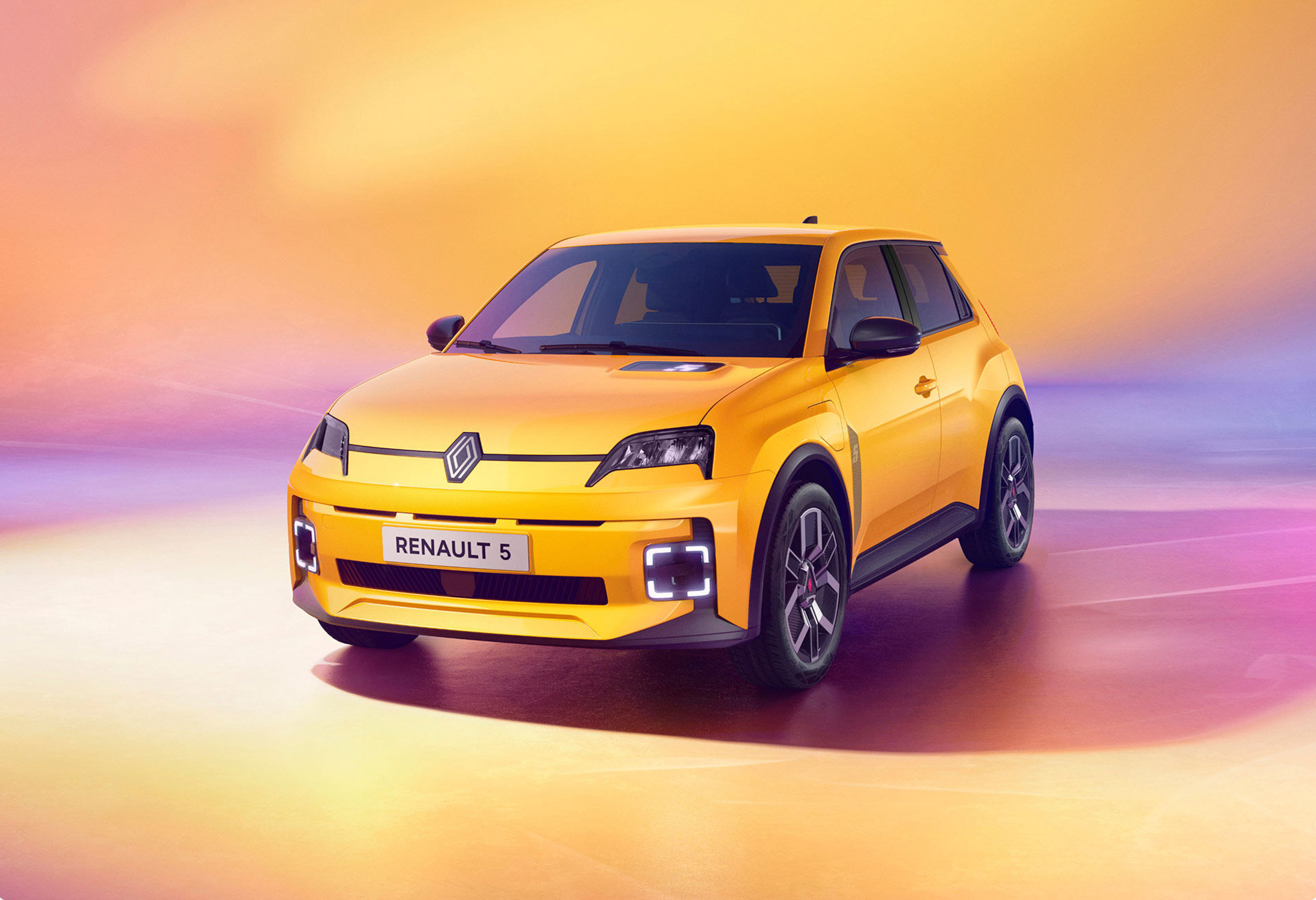 A yellow Renault electric vehicle charging